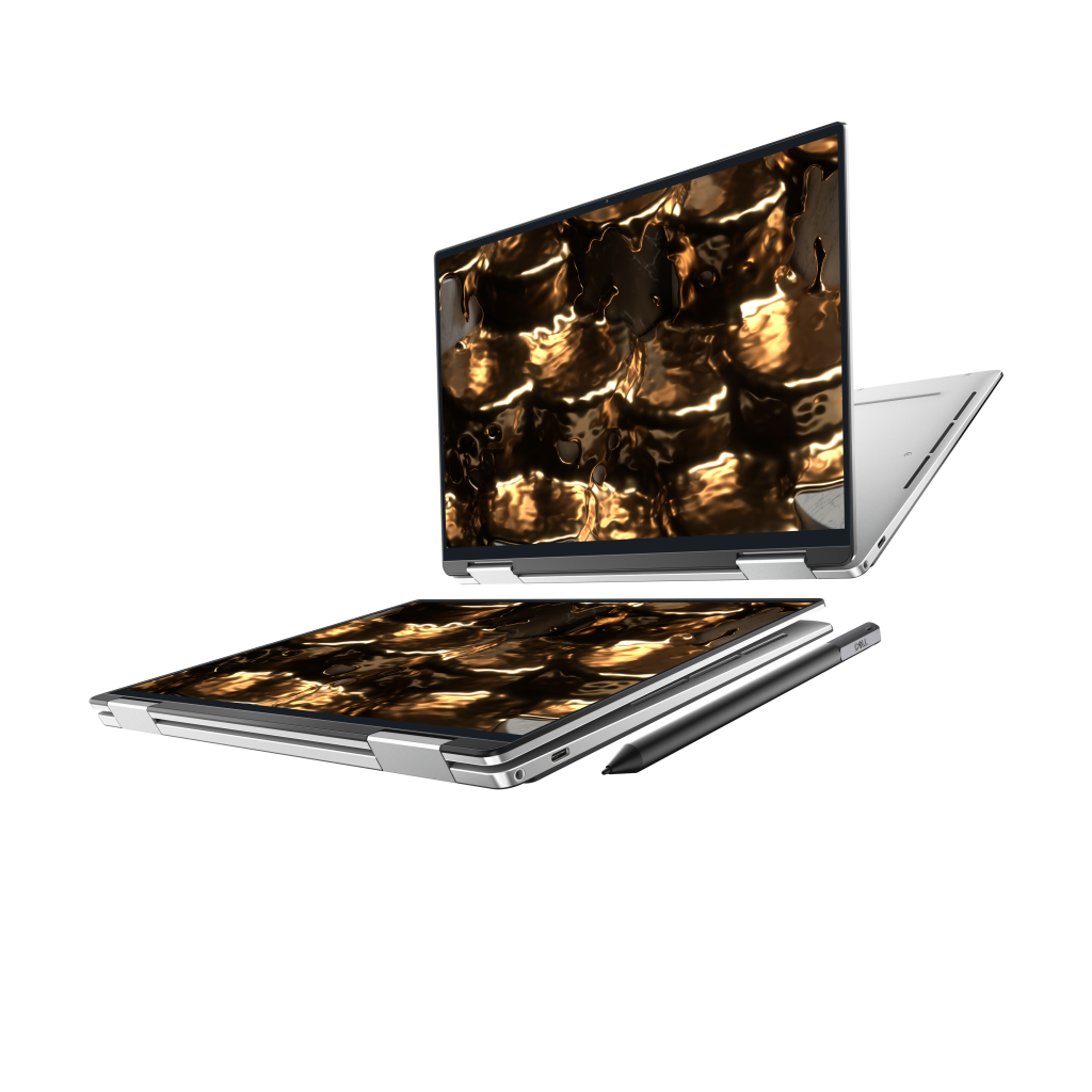 Două laptopuri argintii suprapuse, cu imagini aurii pe ecrane.